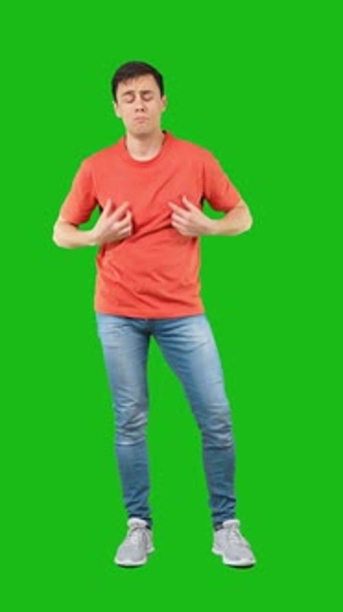 Proud Male Looking at Camera Green Background