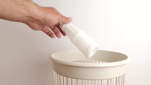 Recycling Plastic Bottles in Trash Bin