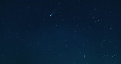 Timelapse of Comet Lemmon crossing a clear night sky filled with countless stars. The glowing tail