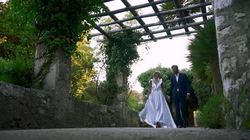 Romantic Couple Walking in a Tropical Garden