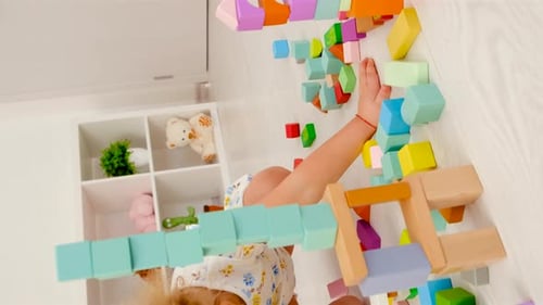 Child Playing with Building Blocks at Home