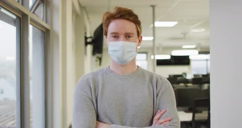 Man in Mask Standing Indoors