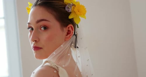 Woman with Flowers and Veil in Close-Up Shot