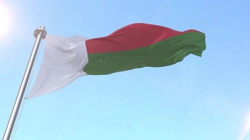 Realistic Madagascar Flag Waving in Blue Sky