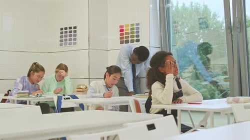 Students Writing in a Classroom Setting
