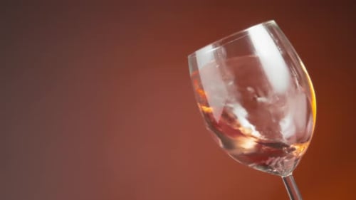Wine Swirling Inside Glass in Close Up Shot