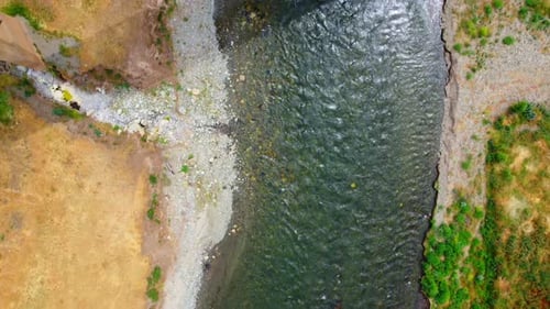 Top View Of A Carfree Bridge Over A Small River