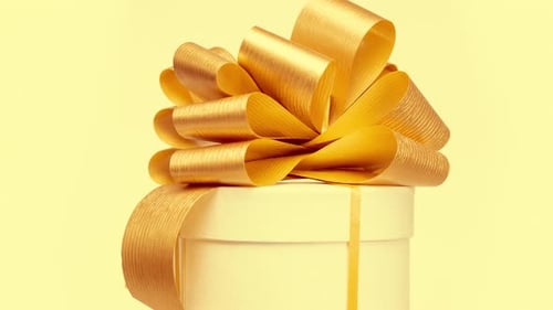 Elegant Gift Box with Gold Ribbon Slowly Rotating