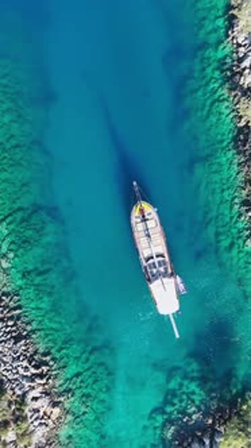 Vertical drone view of wooden gulet yacht
