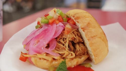 Burger with Pulled Pork Meat Close Up of a Fresh Mexican Cuisine Cheese on Paper for Sale at a