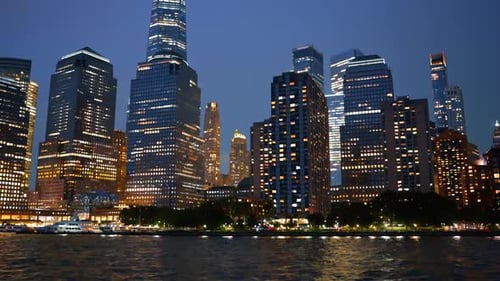 Dazzling New York, USA at dusk time. Light flashes illuminating skyline. Low angle view.