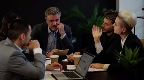 Five Businesspeople with Boss Brainstorming in Office Team of Productive Colleagues Discussion