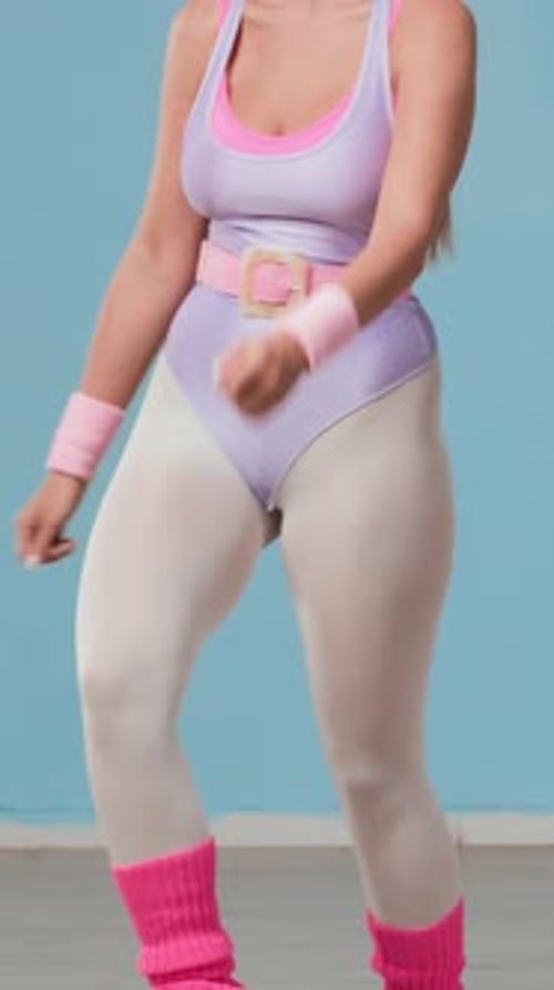 Woman in Retro Outfit Doing Step Aerobics