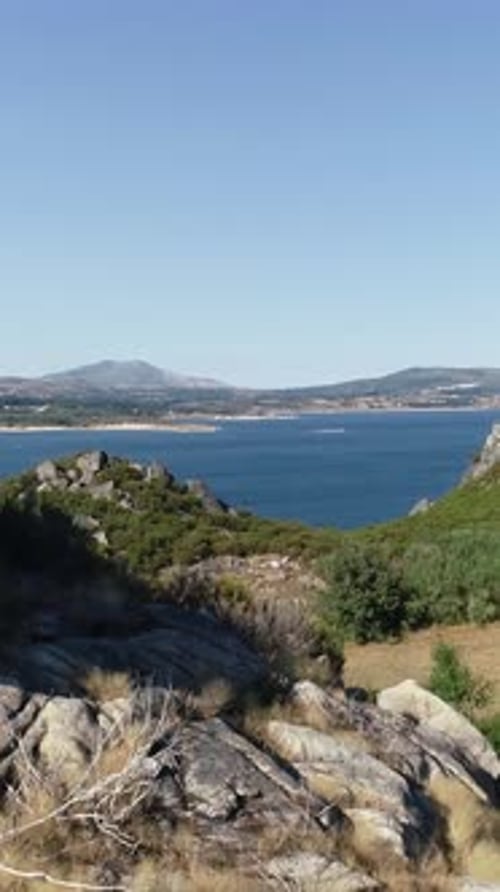 Vertical Video of Lake with Mountains in the Background