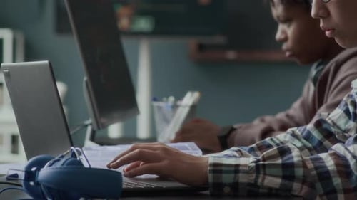 Teens Working on Computers at Desk