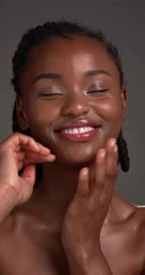 Laugh, skincare and face of black woman in studio for smooth skin, facial and natural beauty