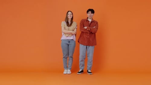 Cheerful Lady and Asian Guy Show OK Signs with Fingers