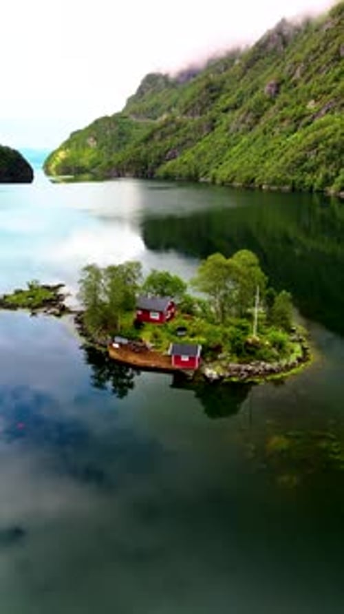 Aerial View of the Idyllic Lovrafjorden in Norway Featuring Charming Red Cottages Among Nature