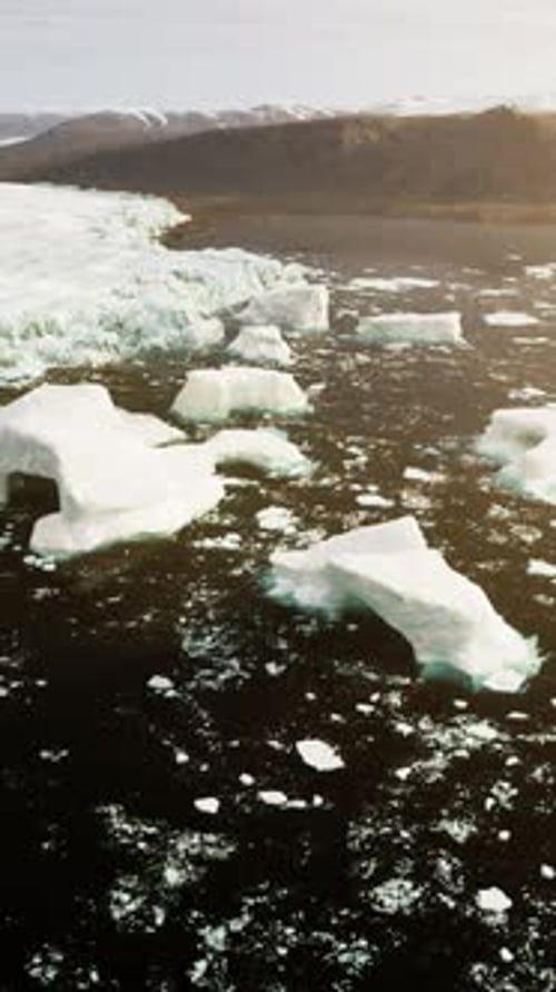 Icebergs Floating in the Water From an Aerial Perspective