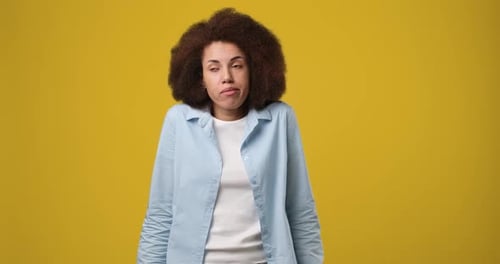 Woman Shrugging with I Don't Know Gesture