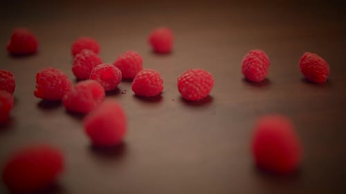 Fresh Organic Red Raspberries Fruits on Wooden Table Background
