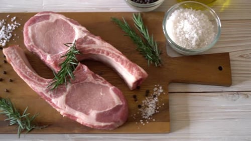 Fresh Raw Pork Chops with Rosemary and Spices
