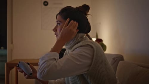 Serious Girl Holding Gamepad at Evening House Closeup Gamer Pushing Buttons