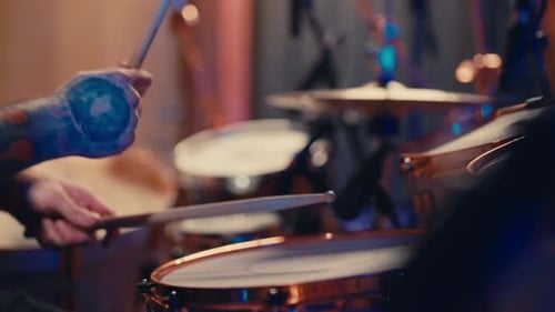 Closeup View of Drummer Hands with Drumsticks Playing Rock Music in Studio Contemporary Musical