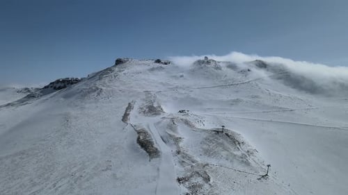 Snowy Mountain Peak Aerial View in Winter