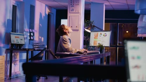 Woman Working At Her Desk At Night