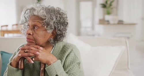 Senior Woman Resting Chin on Hands Indoors
