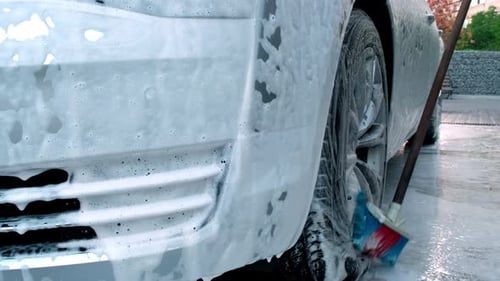 Washing Luxury Silver Car on Touchless Car Wash Washing Sedan Car with Foam Selfservice and High