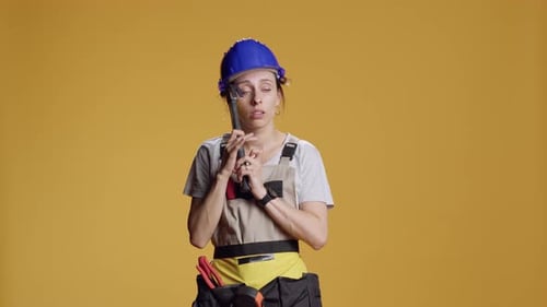 Portrait of Powerful Female Builder Having Headache