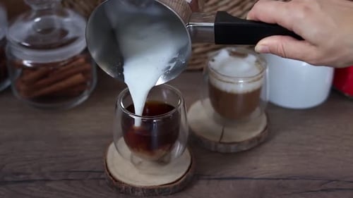 Pouring Milk into Coffee for Latte Art