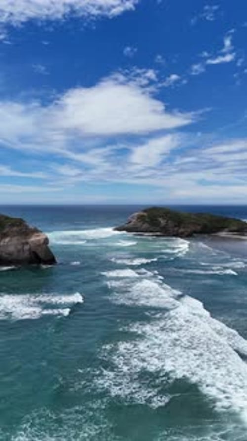 An Aerial View of the Coastal Rock Formations That Beautifully Line the Coastline Vertical Video