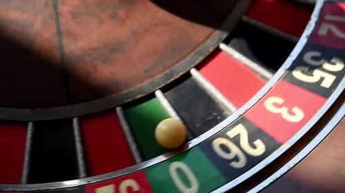 A Closeup View of an Old Roulette Wheel Spinning Showcasing Its Classic Design and the Thrill of the