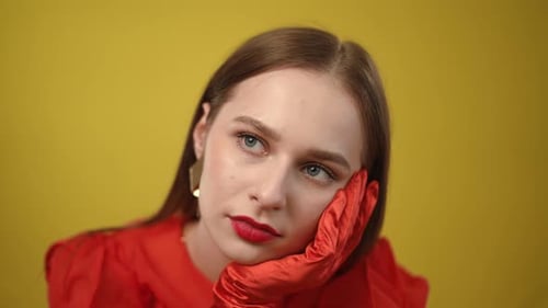 Woman in Red Posing in Studio