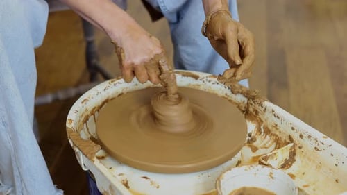 Close Up of Female Hands Shaping Clay on Pottery Wheel in Ceramic Studio Handmade Pottery Process