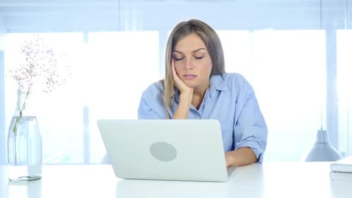 Sleeping Woman in Office Tired of Work Load