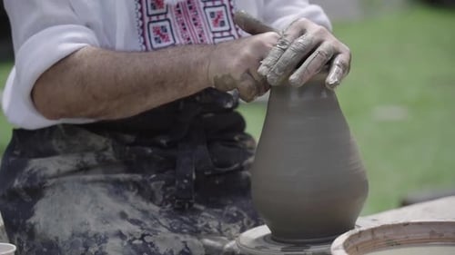 Potter Working On Clay Pitcher