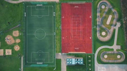 Recreational green grass active sports hockey and football fields overhead top down view. Competitio