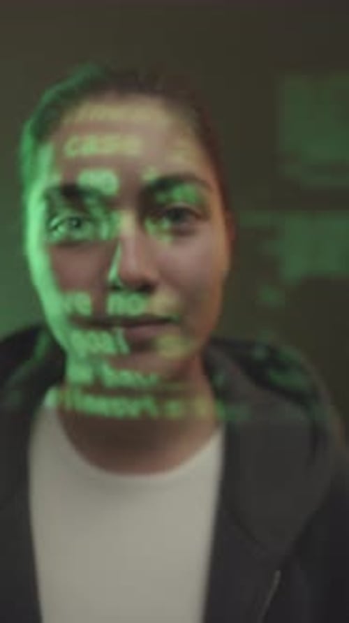 Vertical Portrait of Female Programmer with Code on Her Face