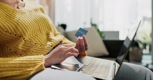 Young Adult with Laptop and Credit Card at Home