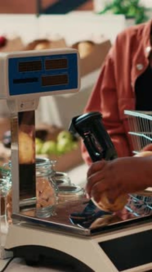 Vertical Video Grocery Store Owner Weighting Fruits and Vegetables on Scale