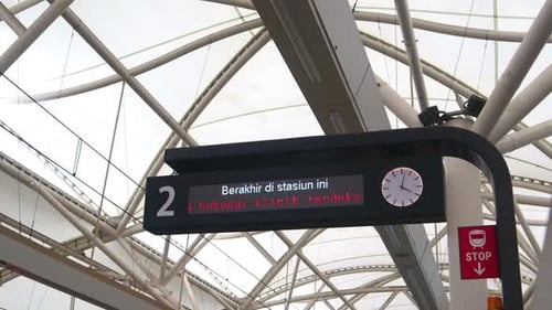 Medium shot of MRT station LED panel description.