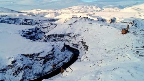 Menucehr Mosque Minaret Above Snowy Canyon