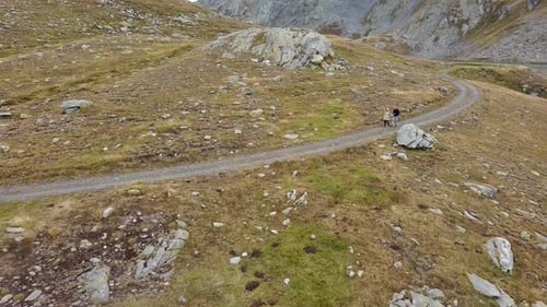 Hikers Walking On The Mountain Trail To The Lago di Naret In Daytime In Val Sambuco, Ticino, Switzer