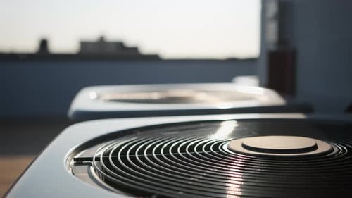 Two Home HVAC Air Conditioner System Close Up Day Time