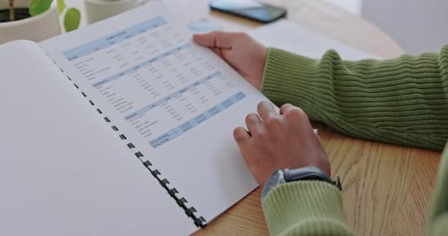 Man, hands and checking document for finance, expenses or mortgage bills on table at home