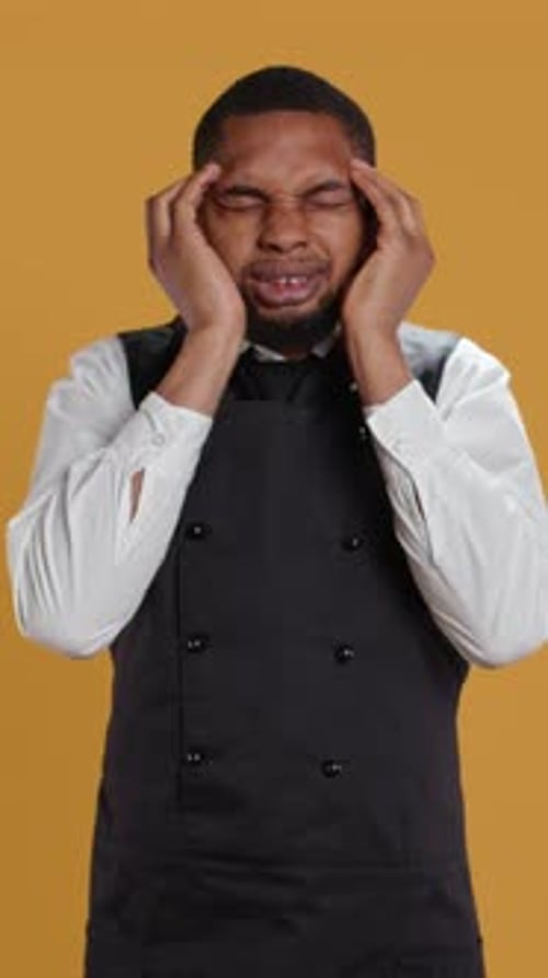 Vertical Video Restaurant Employee Suffering From a Headache and Being Sick
